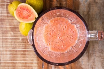 Red guava juice in a blender top view