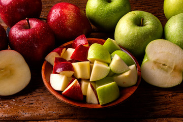 Ripe red and green apples on table close up