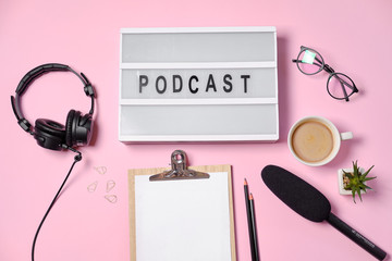 Music or podcast background with headphones, microphone, coffee and blank on pink table, flat lay. Top view, flat lay - obrazy, fototapety, plakaty
