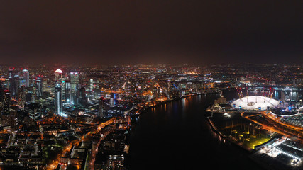 Aerial drone night photo from iconic isle of Dogs peninsula and Docklands area, London, United Kingdom
