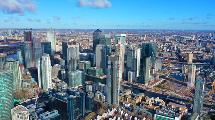 Aerial bird's eye panoramic photo taken by drone of iconic Canary Wharf skyscraper complex and business district, Isle of Dogs, London, United Kingdom