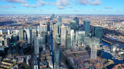 Aerial bird's eye panoramic photo taken by drone of iconic Canary Wharf skyscraper complex and business district, Isle of Dogs, London, United Kingdom