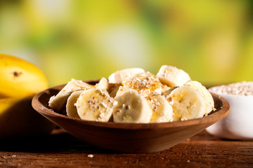 oatmeal with banana and honey in bowl, close-up, horizontal