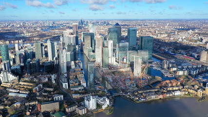 Aerial bird's eye panoramic photo taken by drone of iconic Canary Wharf skyscraper complex and...