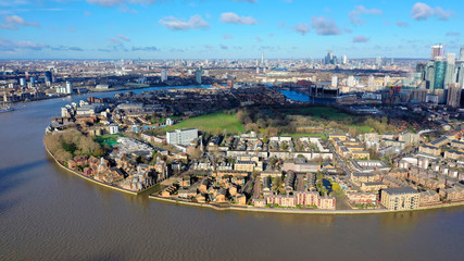 Fototapeta premium Aerial bird's eye view photo taken by drone of famous Docklands and Canary Wharf skyscraper complex, Isle of Dogs, London, United Kingdom