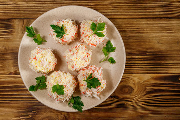 Appetizer of crab-cheese balls on wooden table. Top view