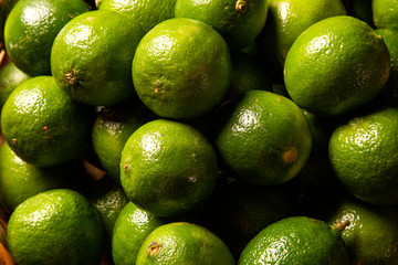 Close Up Lime in a wood Basket.