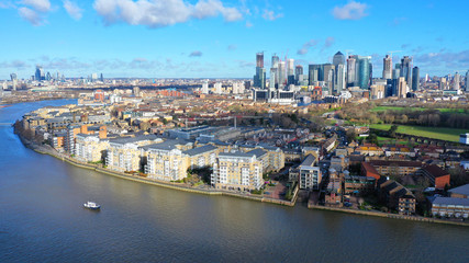 Fototapeta na wymiar Aerial bird's eye view photo taken by drone of famous Docklands and Canary Wharf skyscraper complex, Isle of Dogs, London, United Kingdom
