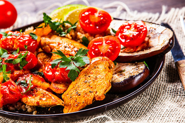 Roasted meat, groats and vegetables