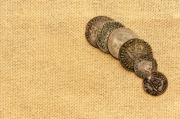 Silver coins on linen background