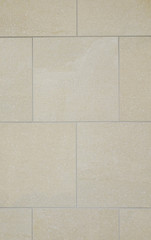 Naklejka premium 壁の大きいタイル、石、背景素材