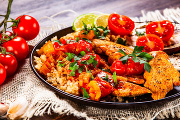 Roasted meat, groats and vegetables