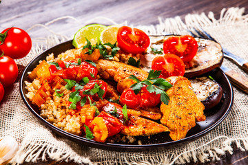 Roasted meat, groats and vegetables