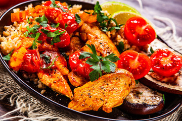 Roasted meat, groats and vegetables