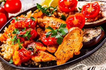 Roasted meat, groats and vegetables