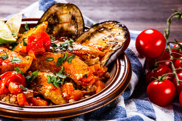 Roasted meat, groats and vegetables