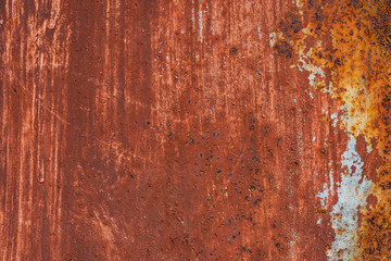 Macro texture of peeled paint on rusty iron closeup.