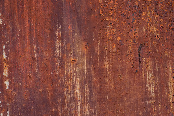 Macro texture of peeled paint on rusty iron closeup.