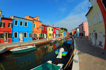 Colored houses and boats of Burano Island near Venice