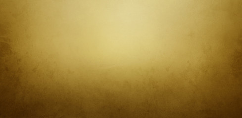 Vintage gold and brown background with old paper or paint texture and elegant antique golden yellow colors