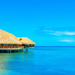 View of the bungalow in the lagoon Huahine, French Polynesia. Copy space for text.