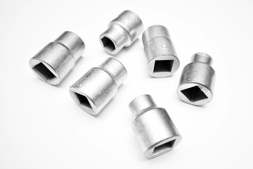 Screwdriver and wrench heads on the white background