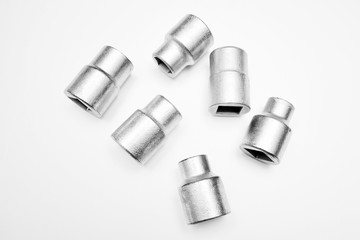 Screwdriver and wrench heads on the white background