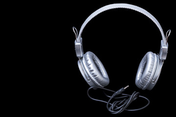 Silver headphones on black