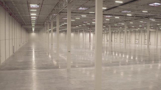 Warehouse interior empty smooth footage from dolly shot