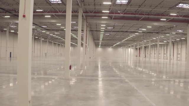 Warehouse interior empty smooth footage from dolly shot