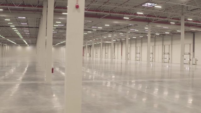 Warehouse interior empty smooth footage from dolly shot