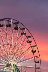 Wall murals Coral Ferris wheel at the sunset