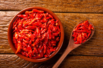 red hot chilli peppers on wooden background, Latin term Capsicum frutescens, Malagueta.