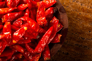 red hot chilli peppers on wooden background, Latin term Capsicum frutescens, Malagueta.