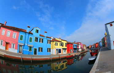 Fototapeta na wymiar waterway on Burano Island and the famous Colourfully painted hou