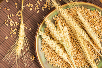 Reap of durum wheat from different varieties.  Wheat grains in a plate. Top view.