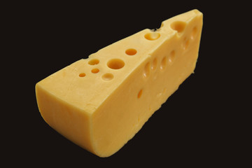 Cheese with big holes against dark background