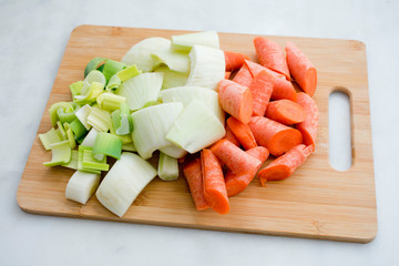 Chopped Leeks, Fennel, and Carrots on a Cutting Board