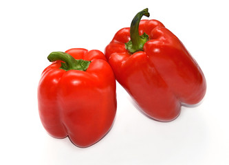 Bell pepper on white background. Two red peppers. Isolated backdrop. Macro. Closeup. Fresh vegetables. Organic food.