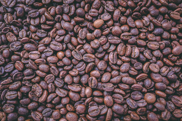Roasted coffee beans background tinted