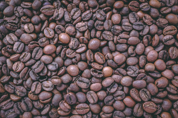 Roasted coffee beans background tinted