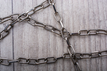 chain made of silver color metal on a grey background