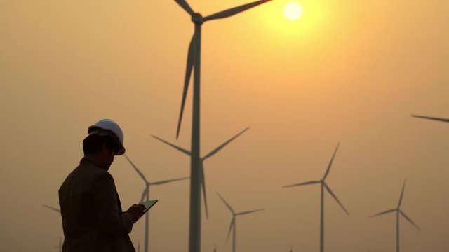 Asian engineers are working with warm sunset light footage 4K