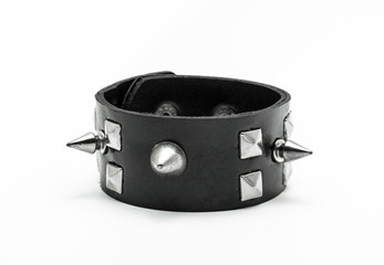 Rock bracelet with silver spikes isolated on white background. Accessory for punk, metal and gothic...