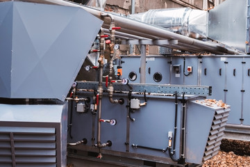 Side view of the commercial central air handling unit with cooling coil