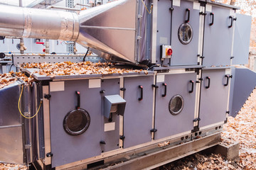 Side view of the commercial central air handling unit with cooling coil