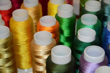 multicolored reel of thread