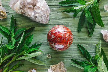 Brecciated, Red Jasper Sphere with Quartz and Santa Barbara Sage on Green Stained Wood