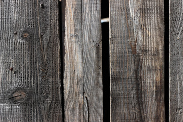 Wood planks picket fence detail old aged brown