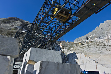 Apuan Alps, Carrara, Tuscany, Italy. March 28, 2019. An overhead crane in a white marble quarry